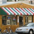 (Downtown, Tybee Island, GA) Scooter’s 870th bar, first visited in 2011. There are two entrances to this establishment. The door on the left leads to the bright-decored pizza (and more)...