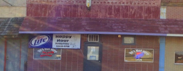 He’s Not Here (Downtown, Dexter, MO) Scooter’s 962nd bar, first visited in 2012. Stopped in here for a couple of drinks on the day after Thanksgiving. The long bar had several middle-aged to...